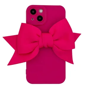 Pink silicone phone case with large bow for iPhone 13 12 Pro, cute girly protective back cover.