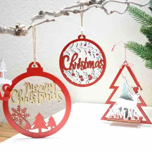 Detailed close-up of carved wooden Christmas hanging ornaments and festive tree tabletop decor.