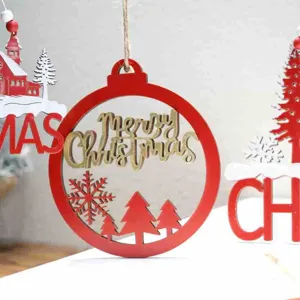 Close-up detail of red wooden Christmas hanging ornament with festive text and tree decor.
