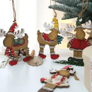 Close-up detail of rustic wooden reindeer hanging ornaments set up in a festive Christmas scene decor.