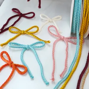 Colorful cotton cord ribbon bows for gift wrapping, Christmas tree decoration and crafts.