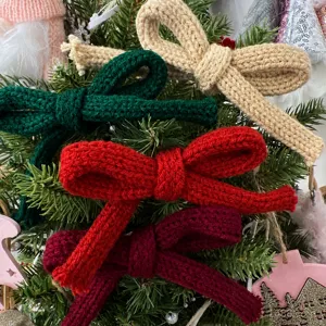 Knitted bowknot ribbon for Christmas gift wrapping, DIY craft decoration, close-up detail view.