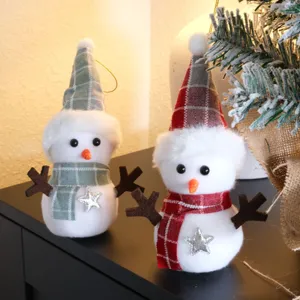 Close-up of cute plaid snowman Christmas hanging pendants with lovely details and festive vibe.