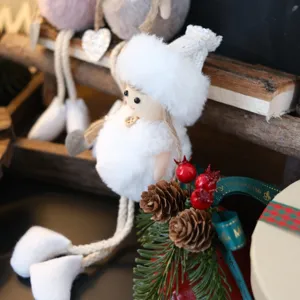 Close-up view of Christmas plush angel doll ornament featuring soft white fluffy outfit and long legs.