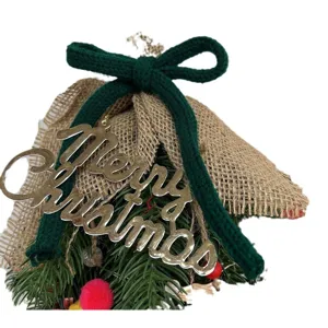 Christmas hanging ornament with burlap wrap green knit bow and gold metal sign decor.