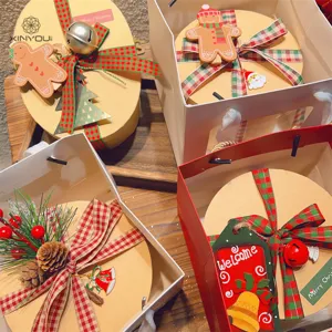 Christmas gift box and red green plaid ribbon set with cute holiday decorations and festive tags.