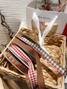 Christmas red and green plaid ribbon detail view for gift wrapping and DIY crafts.