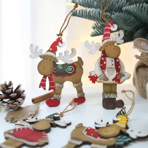 Christmas wooden reindeer hanging pendants, vintage distressed holiday tree decorations.