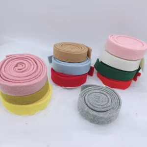 Detailed view of thickened colorful felt ribbon rolls, perfect for Xmas tree DIY crafts and bows.