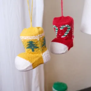 Close-up detail of knitted Christmas stocking hanging decoration for tree and party.