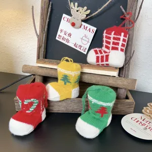 Mini knitted Christmas stockings, festive tree hanging ornaments for holiday home decor.