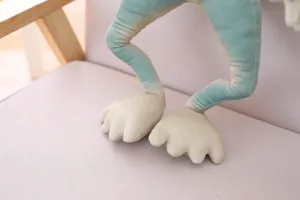 Detailed view of quirky green plush alien doll legs soft fabric funny stuffed toy for creative gifts