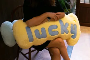 Creative yellow bone shaped plush pillow with blue lucky letters, cozy soft sofa home cushion.