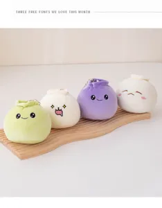 Cute plush dumpling keychain detail view, soft stuffed bag pendant with funny facial expressions.