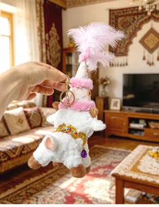Cute plush sheep keychain with pink feathered hat, creative ethnic style bag pendant charm for gifts.