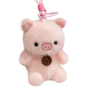 Cute pink pig plush toy keychain, soft stuffed animal pendant for cute bags and keys.
