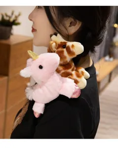Close-up detail of cute magnetic shoulder plush toys featuring unicorn and giraffe on clothing.