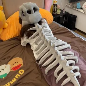 Funny dinosaur skeleton plush headpiece and spine pillow set for novelty cosplay gifts.
