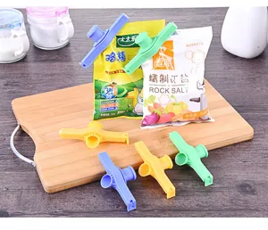 Plastic bag sealing clip with pour spout, kitchen food storage moisture-proof clamp for snacks.