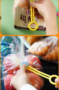 Detailed view of plastic food sealing clip demonstrating bag closure in kitchen use.