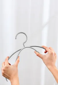 Flexible plastic clothes hanger for home wardrobe organization, anti-break design.