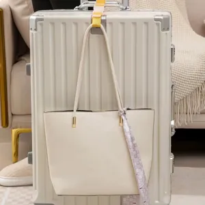 Portable travel luggage strap and bag bungees for secure suitcase carrying and hands-free trips.
