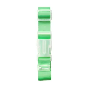 Portable green travel luggage strap with plastic buckle for secure suitcase packing and transit.