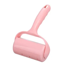 Pink lint roller for clothes, effective pet hair remover sticky brush with protective cover.