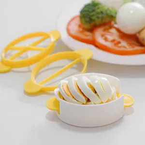 Plastic kitchen egg slicer multi-functional egg cutter tool for boiled eggs and food prep.