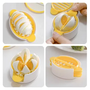 Detailed view of the plastic multi-functional egg slicer showing slicing and cutting features.