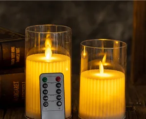 Close-up of LED flameless candles with remote control for timer and brightness adjustment