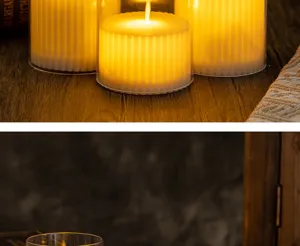 Set of three fluted LED electronic candles in glass holders for cozy home decor