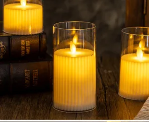 Detailed macro view of warm LED flickering electronic candles in glass jars for decoration