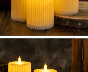 Detailed macro view of LED flameless candles with ribbed texture on wooden surface