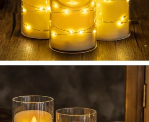 Detailed macro view of warm LED flickering candles with fairy lights in glass jars