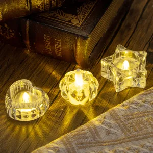 Romantic transparent glass tea light holders in heart and star shapes for dinner decor