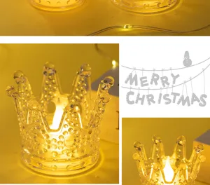 Detailed view of crown-shaped glass LED candle holder for warm festive Christmas decoration