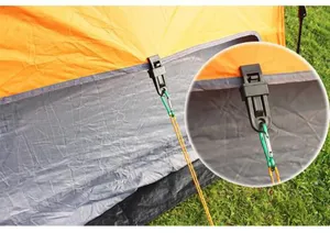 Close-up detail of outdoor camping tent wind rope fixing clip, durable plastic clamp accessory.