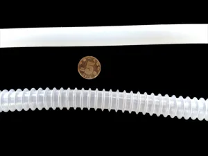 Detailed close-up shot of durable plastic and corrugated suction hoses for fluid transfer use.