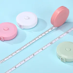 Mini metro a nastro flessibile portatile, doppia scala metrica e imperiale, rosa e bianco.