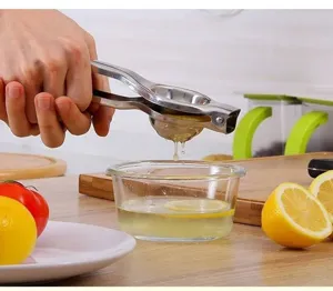 Manual stainless steel lemon squeezer handheld citrus juicer press kitchen accessory.