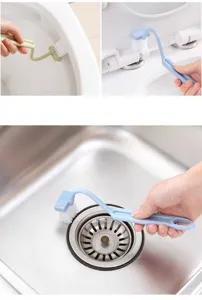 Plastic V-shaped toilet cleaning brush with long handle for bathroom gap and drain.