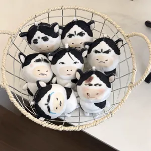 Cute abstract meme cow plush toy pendant with funny facial expressions for bag and key decoration.