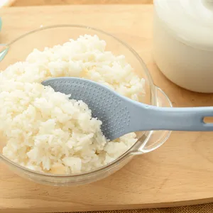 Wheat straw non-stick rice spoon kitchen paddle with ergonomic hanging hole for home use.