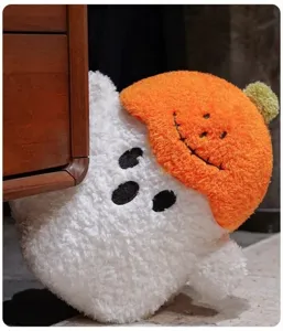 Close-up detail shot of the cute Halloween pumpkin ghost plush toy pillow, soft material.