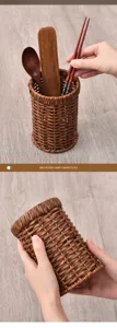Detailed view of the imitation rattan chopstick holder with wooden utensils for kitchen.