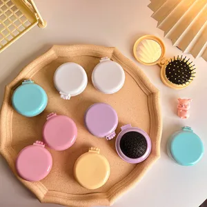 Portable folding hair brush with mirror, compact travel air cushion massage comb in pastel colors.