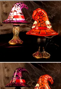 Detailed view of Halloween witch hat table lamps with glowing skull and spider designs