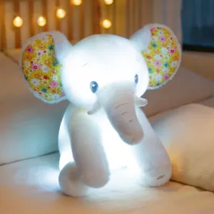 Cute glowing elephant plush toy with colorful LED lights and floral ears, soft night light.