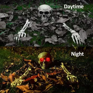 Realistic Halloween skull and skeletal hands with glowing red eyes for yard decor